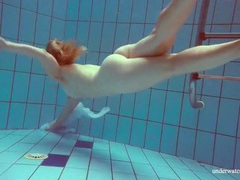 MomsCult presents: Redhead goes for a nude swim in the pool